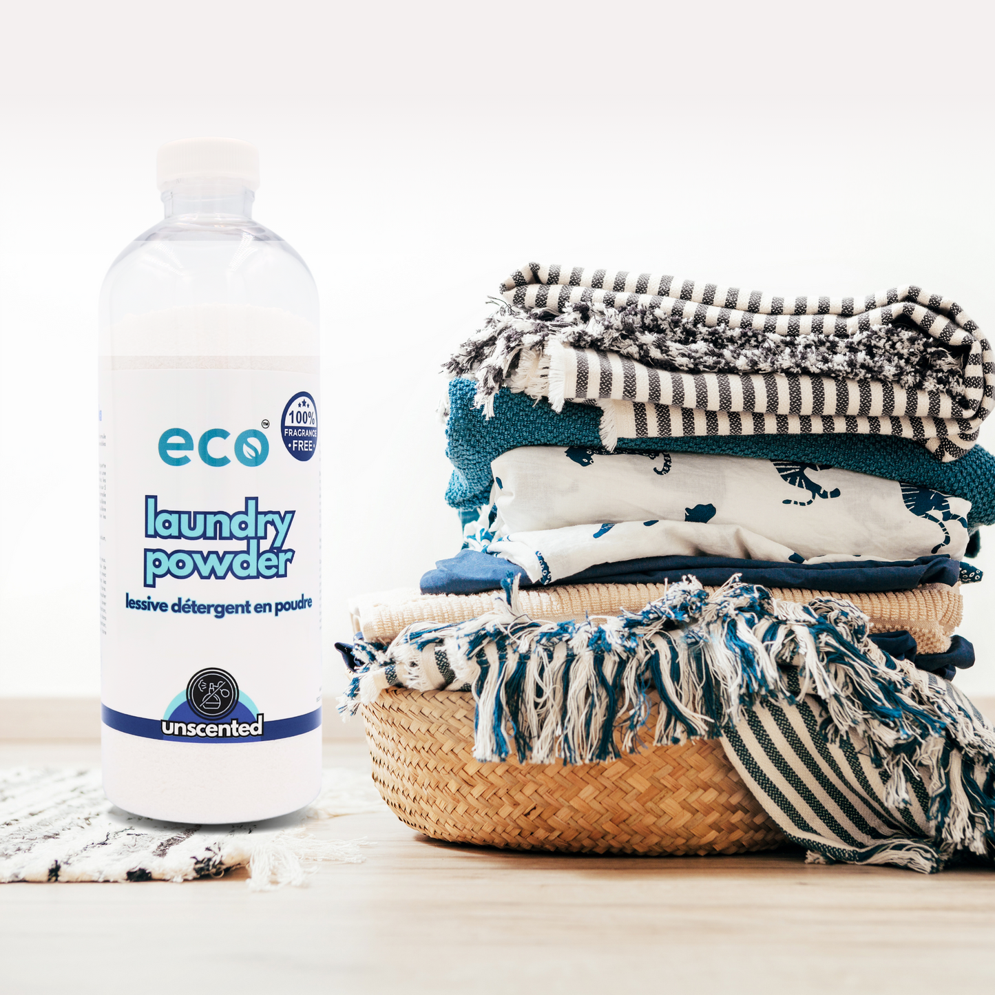 Eco Refillery's laundry powder with a pile of clothes.
