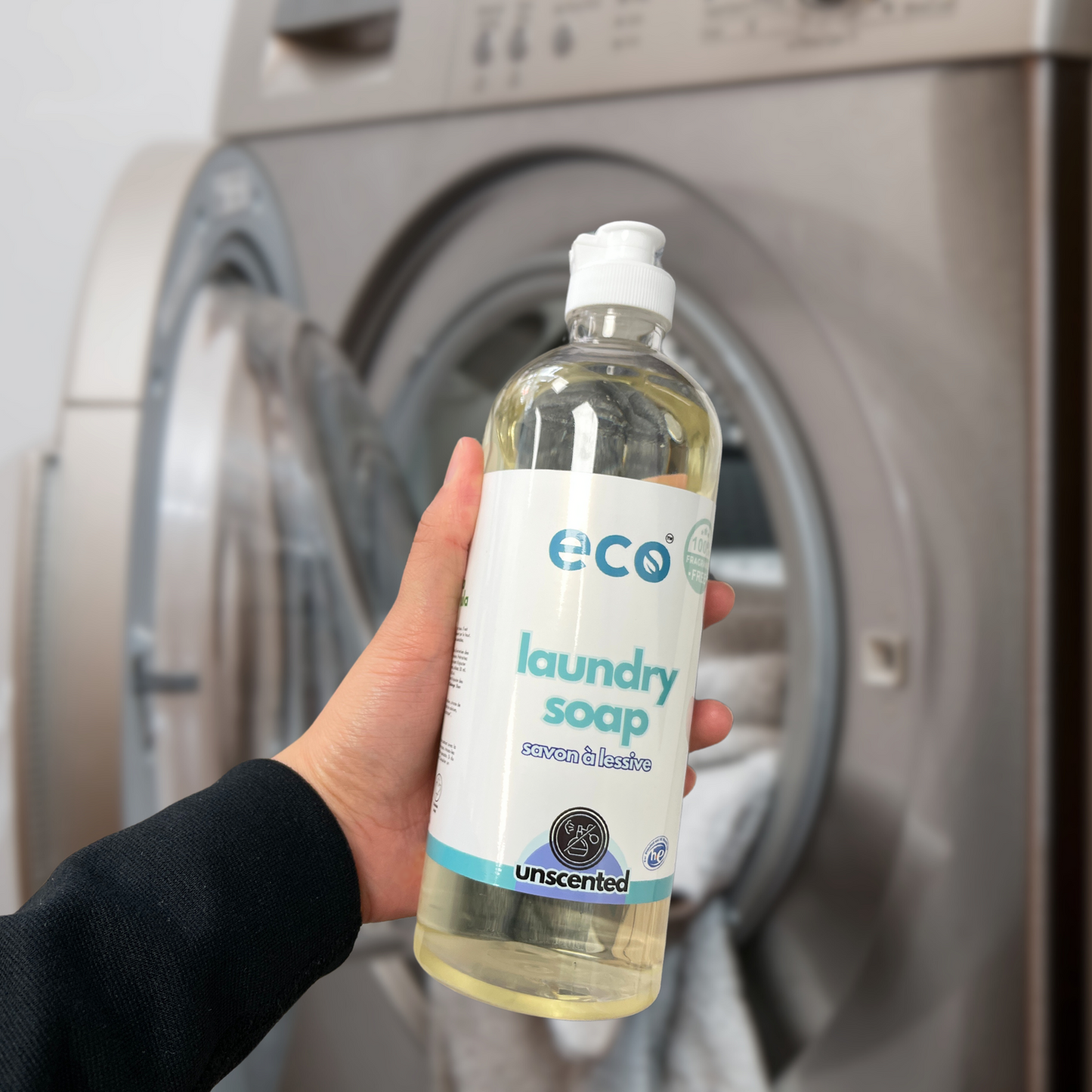 Person using Eco Refillery's laundry soap, for an eco-friendly and plant-based home.