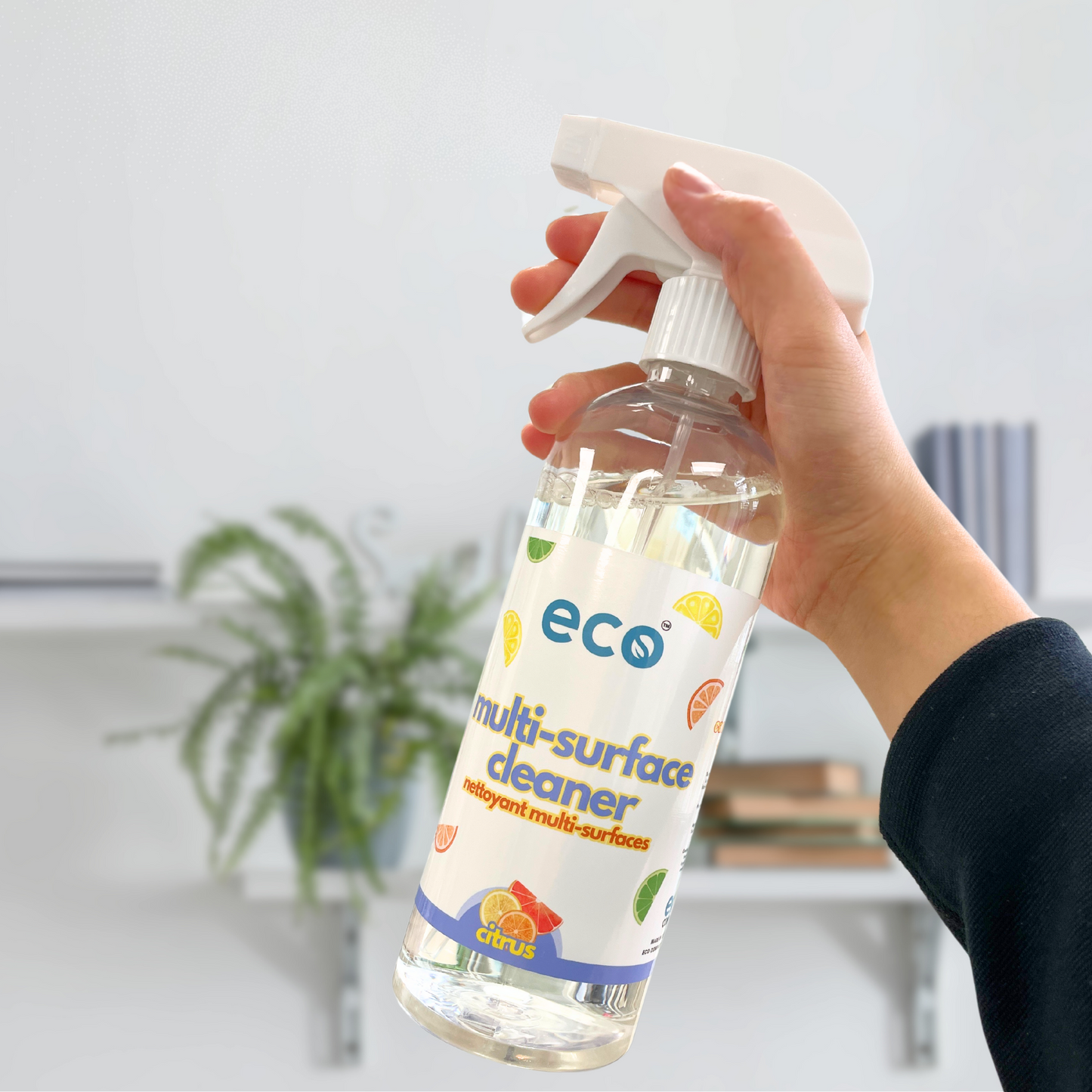 Person uses Eco Refillery's multi-surface cleaner to refresh their home.