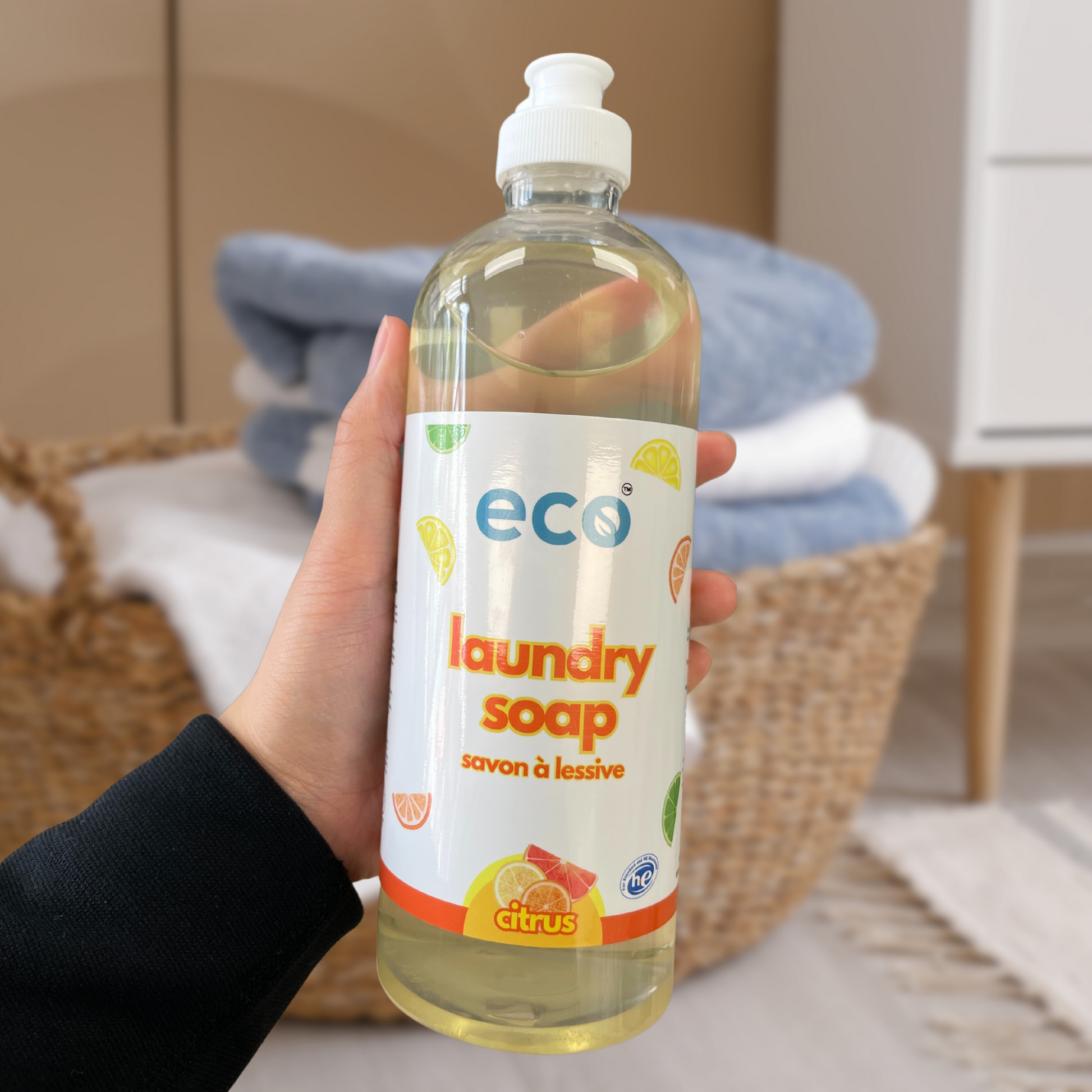 Person holding Eco Refillery's laundry soap, for an eco-friendly and plant-based home.