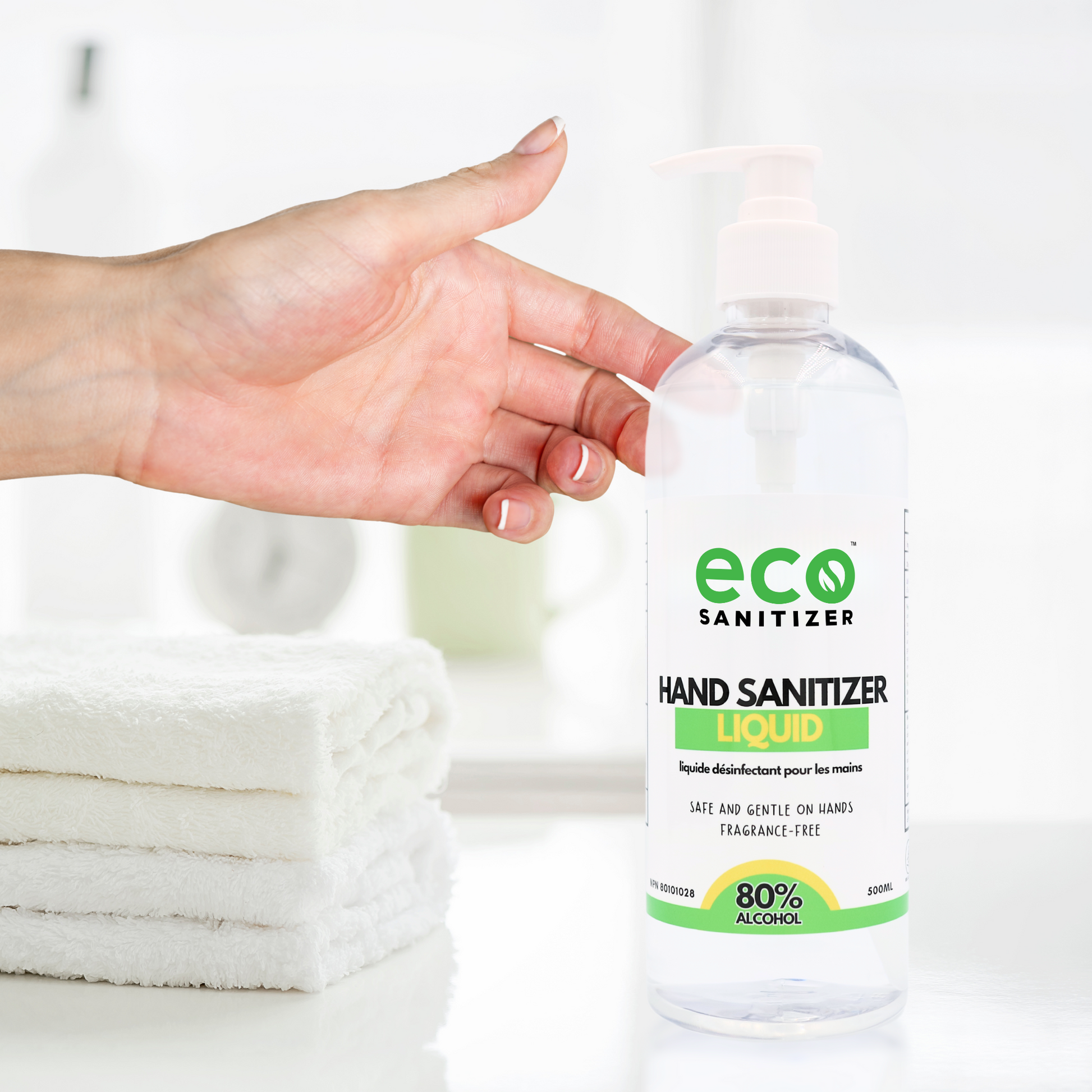 Person pumps Eco Sanitizer hand sanitizer liquid into hands.