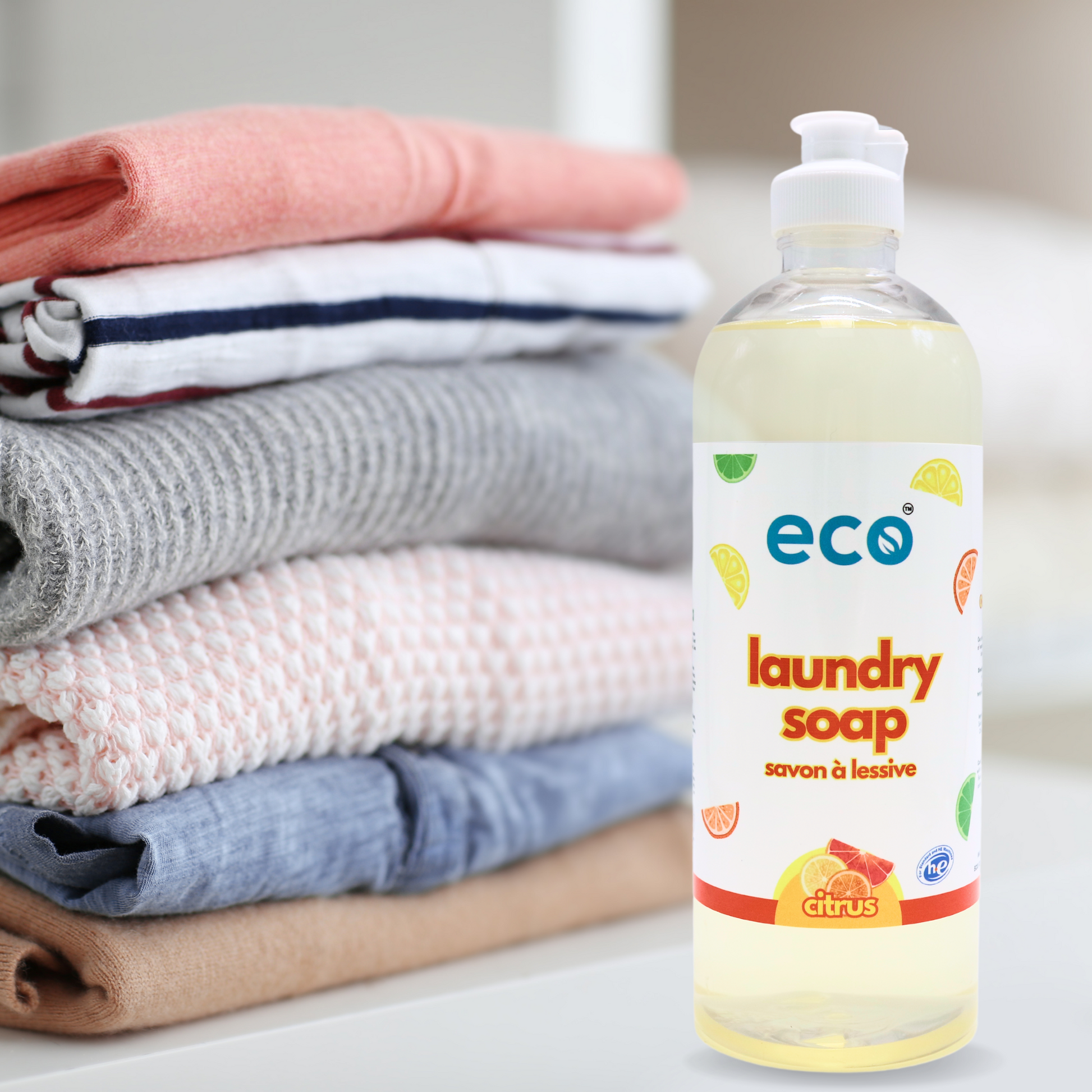 Eco Refillery's laundry soap with a pile of clothes.